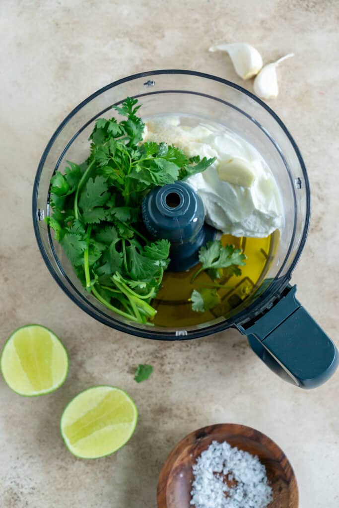 cilantro, lime juice, olive oil, greek yogurt, and garlic in a food processor
