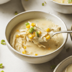 chicken corn soup in a white bowl