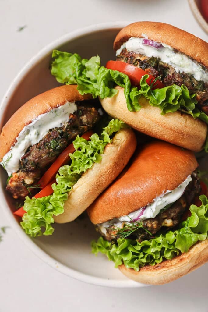 3 air fryer turkey burgers on a plate.