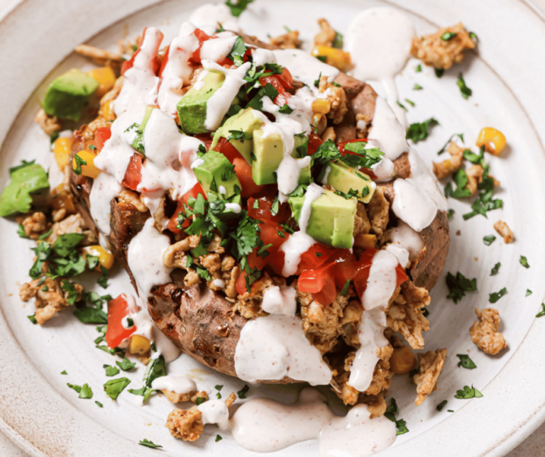 A plate of taco stuffed sweet potatoes.