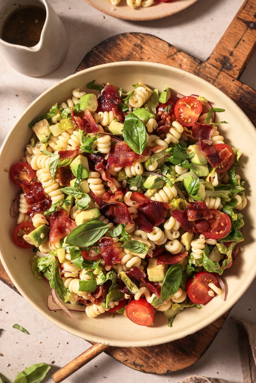 Top down view of a bowl of BLT pasta salad.