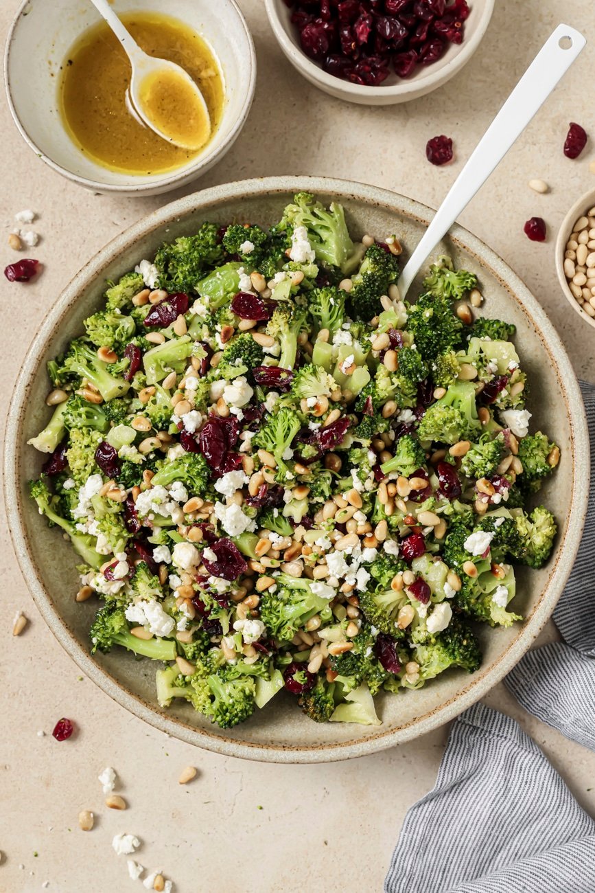 Overhead view of a bowl of warm vegan broccoli salad.