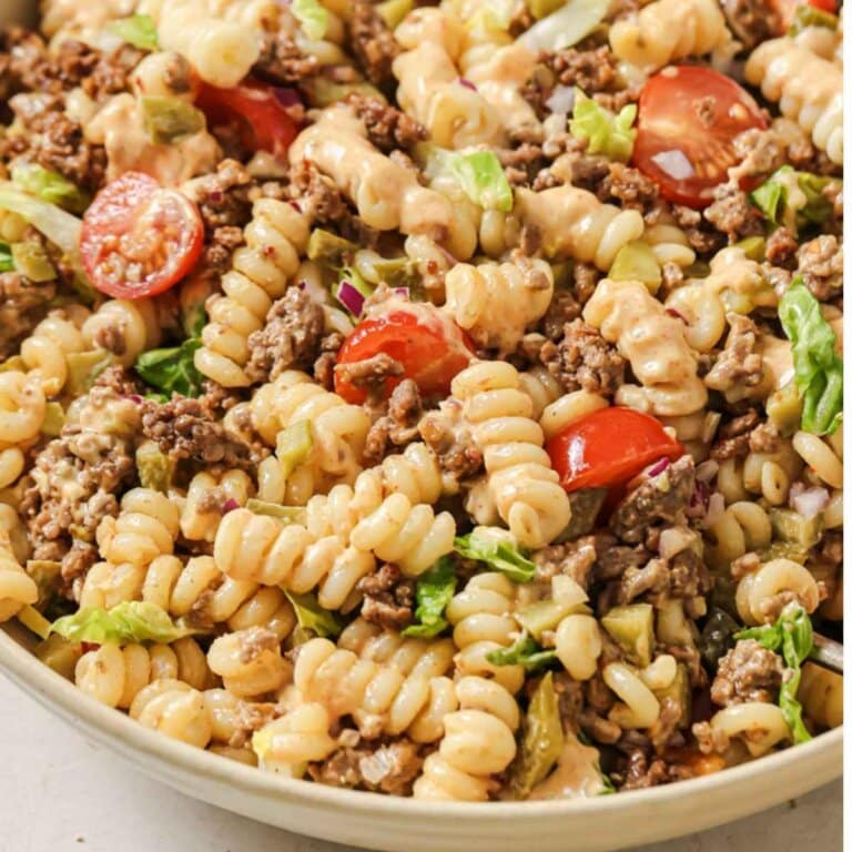 Close up of pasta salad with meat in a bowl.