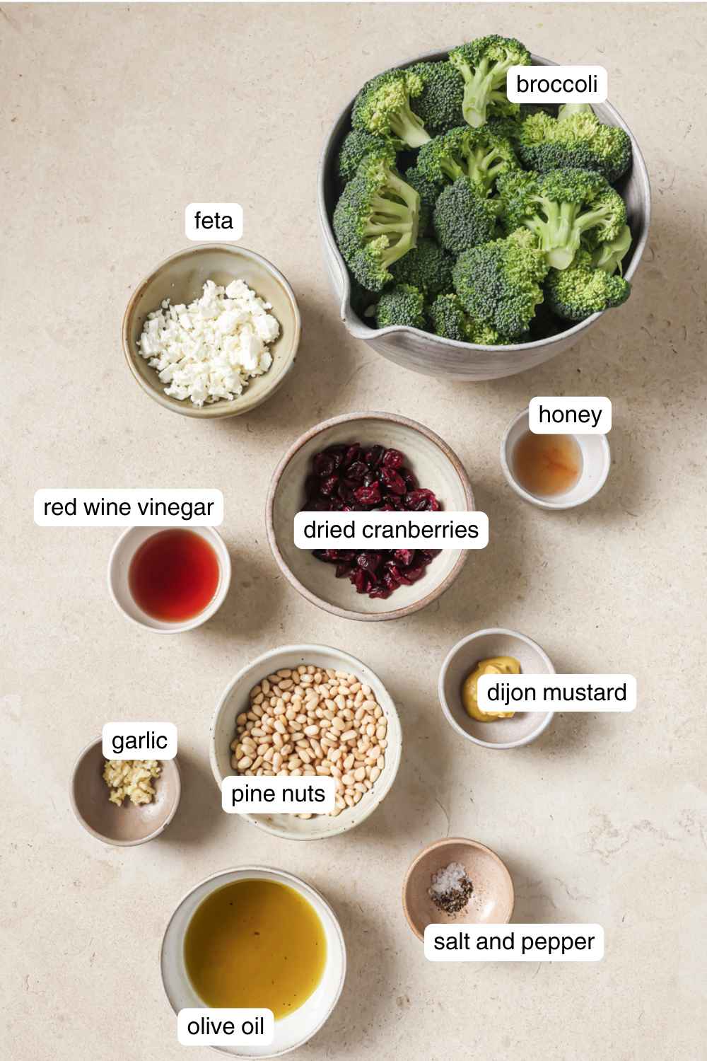 Labeled ingredients for vegan broccoli salad.