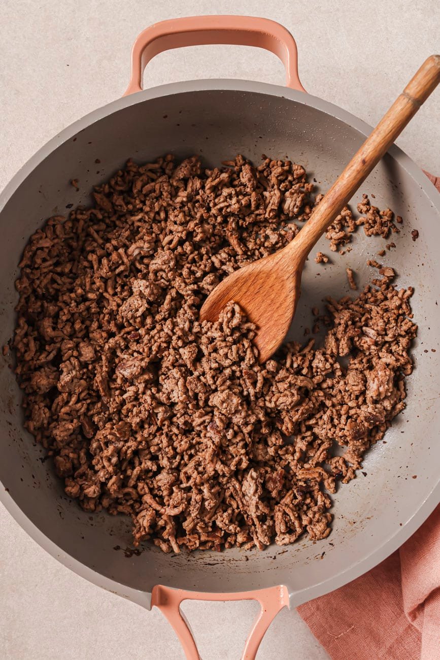 A skillet showing how to brown ground beef.