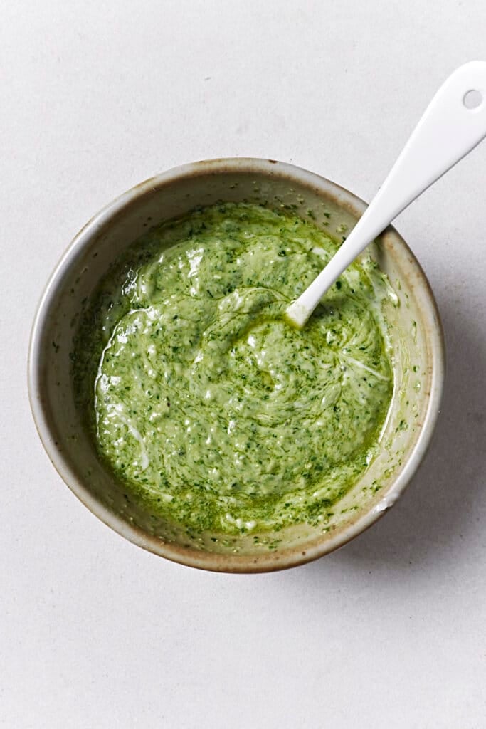 Making pesto spread for turkey sandwiches.