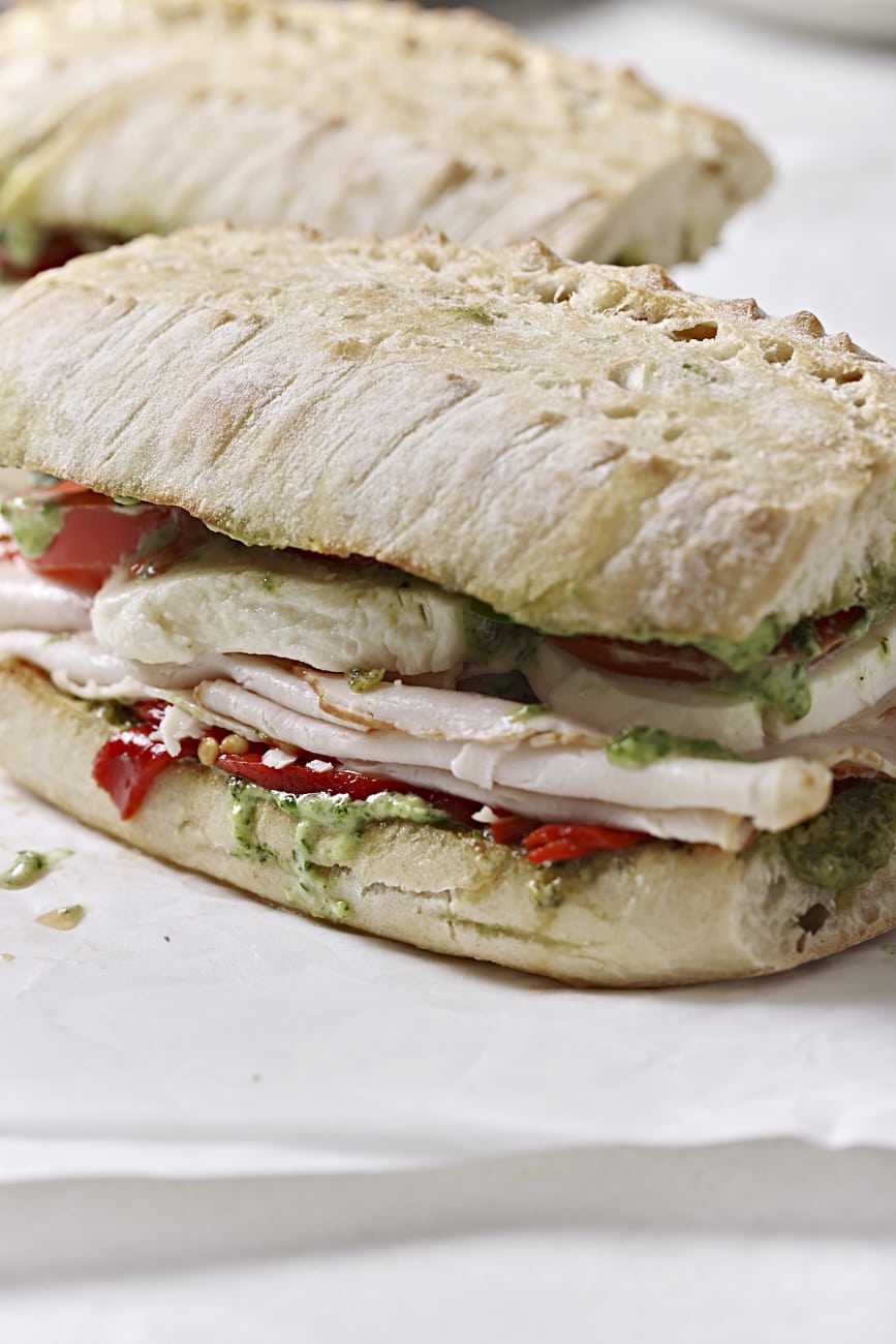 Close up of pesto turkey sandwiches.