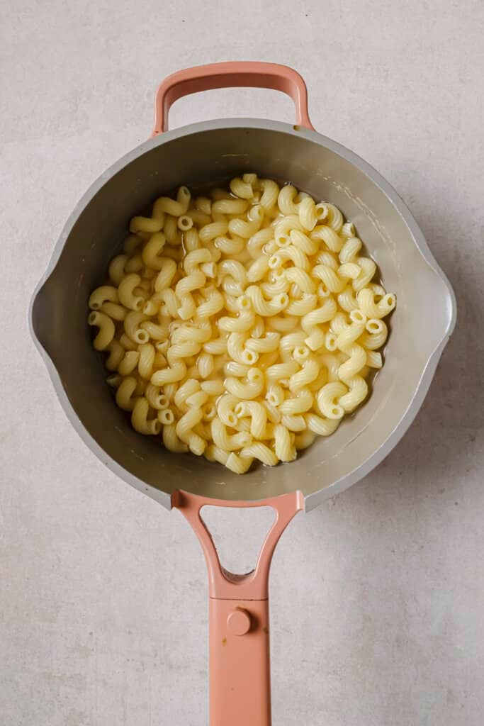 Overhead shot of pasta cooking in a pot.