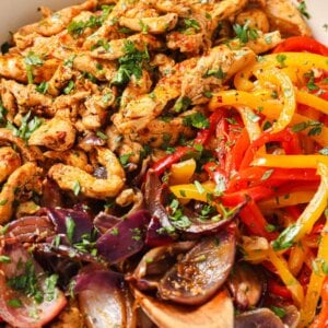 baked chicken and peppers close up.