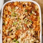 Overhead view of crack chicken casserole in a white baking pan.