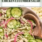 A bowl of 10-minute chicken cucumber salad featuring shredded chicken, sliced cucumbers, pickled red onions, and fresh dill, all garnished with crumbled feta cheese. The ingredients are well-mixed, and the image highlights the fresh and colorful ingredients in a wholesome, easy-to-make salad.