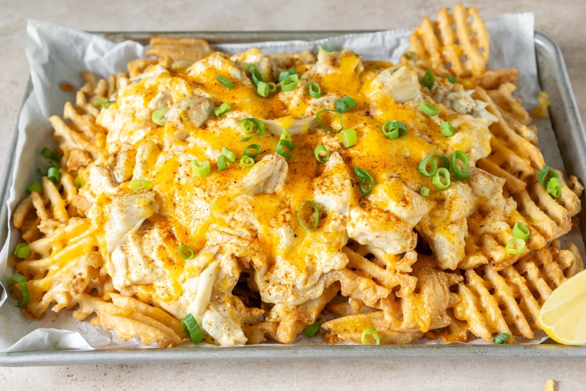 Crab fries on a parchment lined baking sheet.