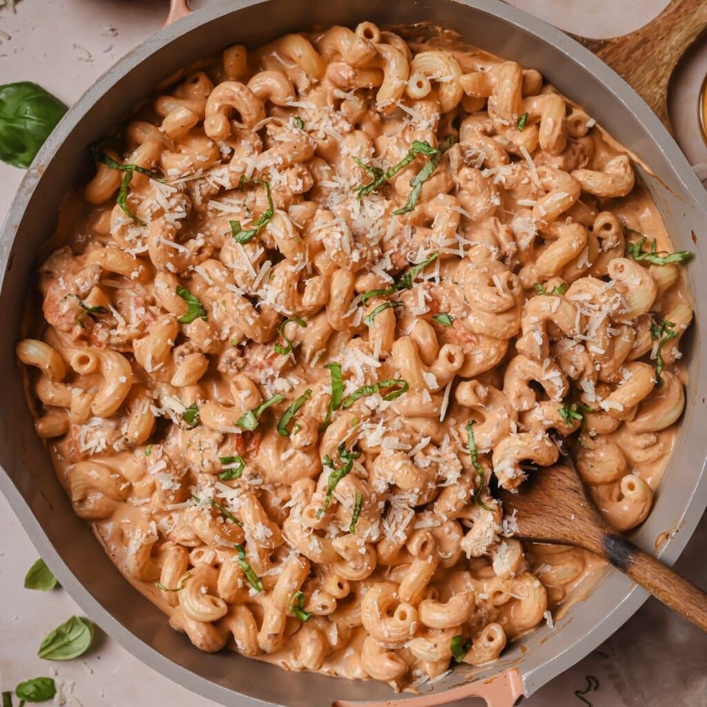 High protein pasta in a pan with a wooden spoon.