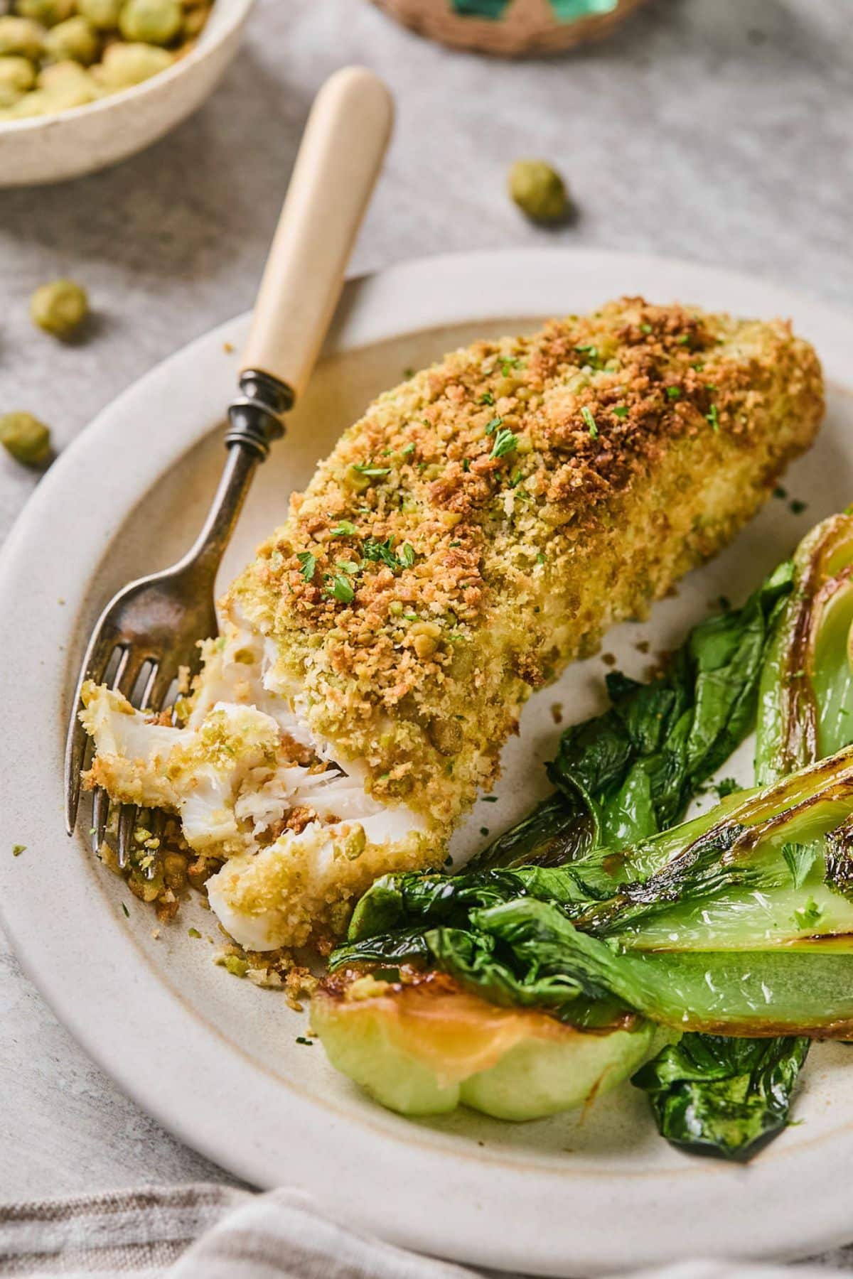 A plate of air fried halibut with roasted bok choy.