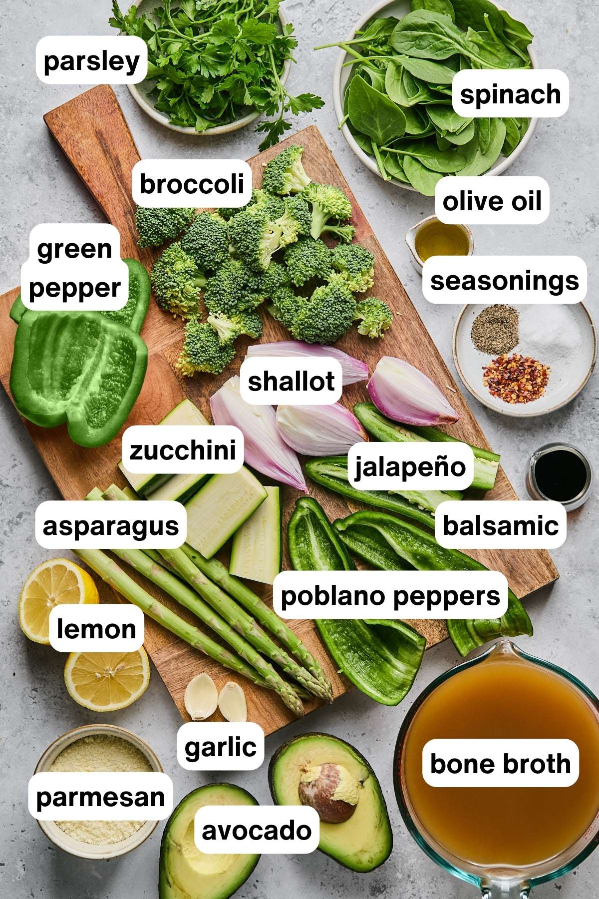 Ingredients for green soup laid out on a cutting board.