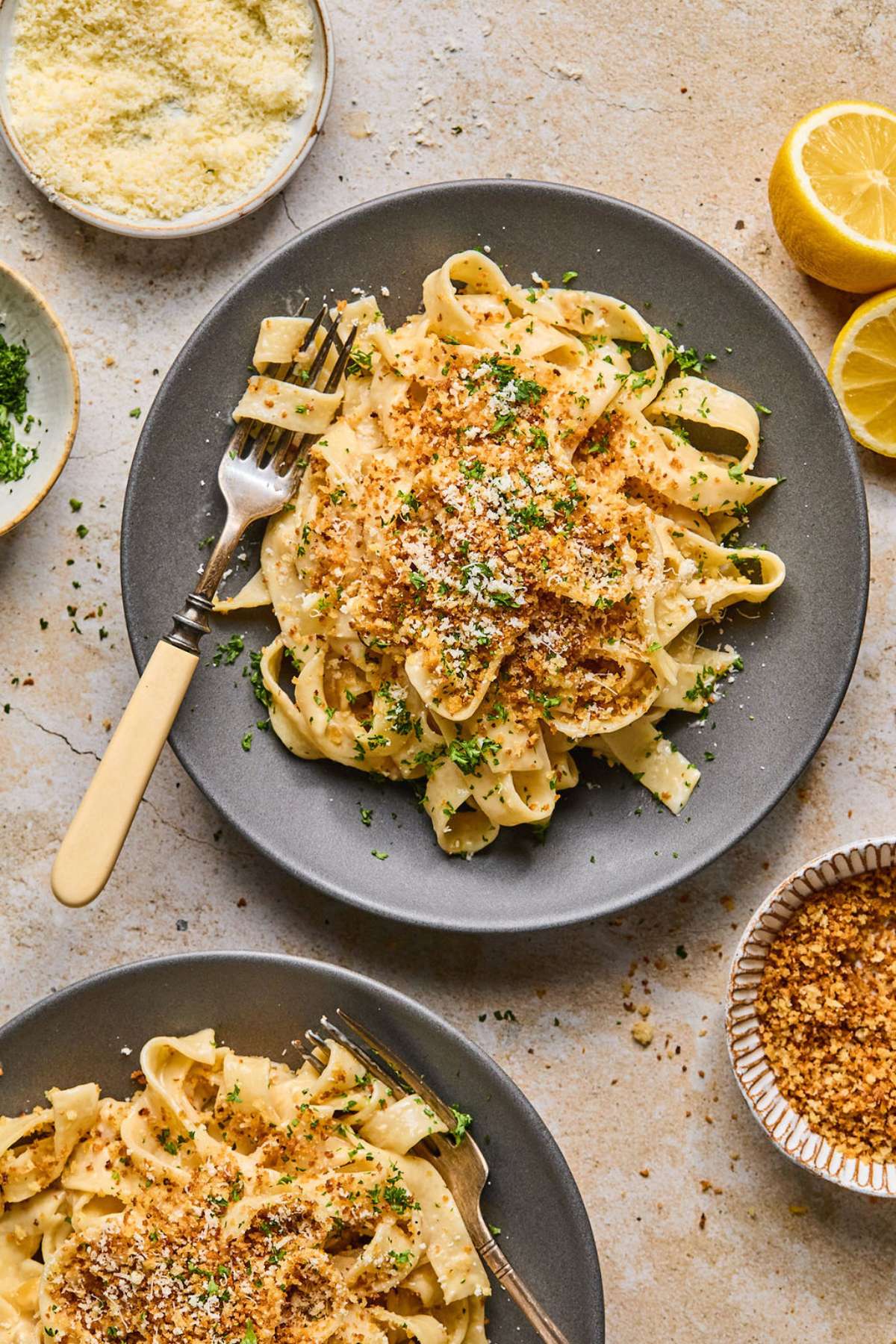 A plate of French onion pasta with a fork with pasta twirled to the side.