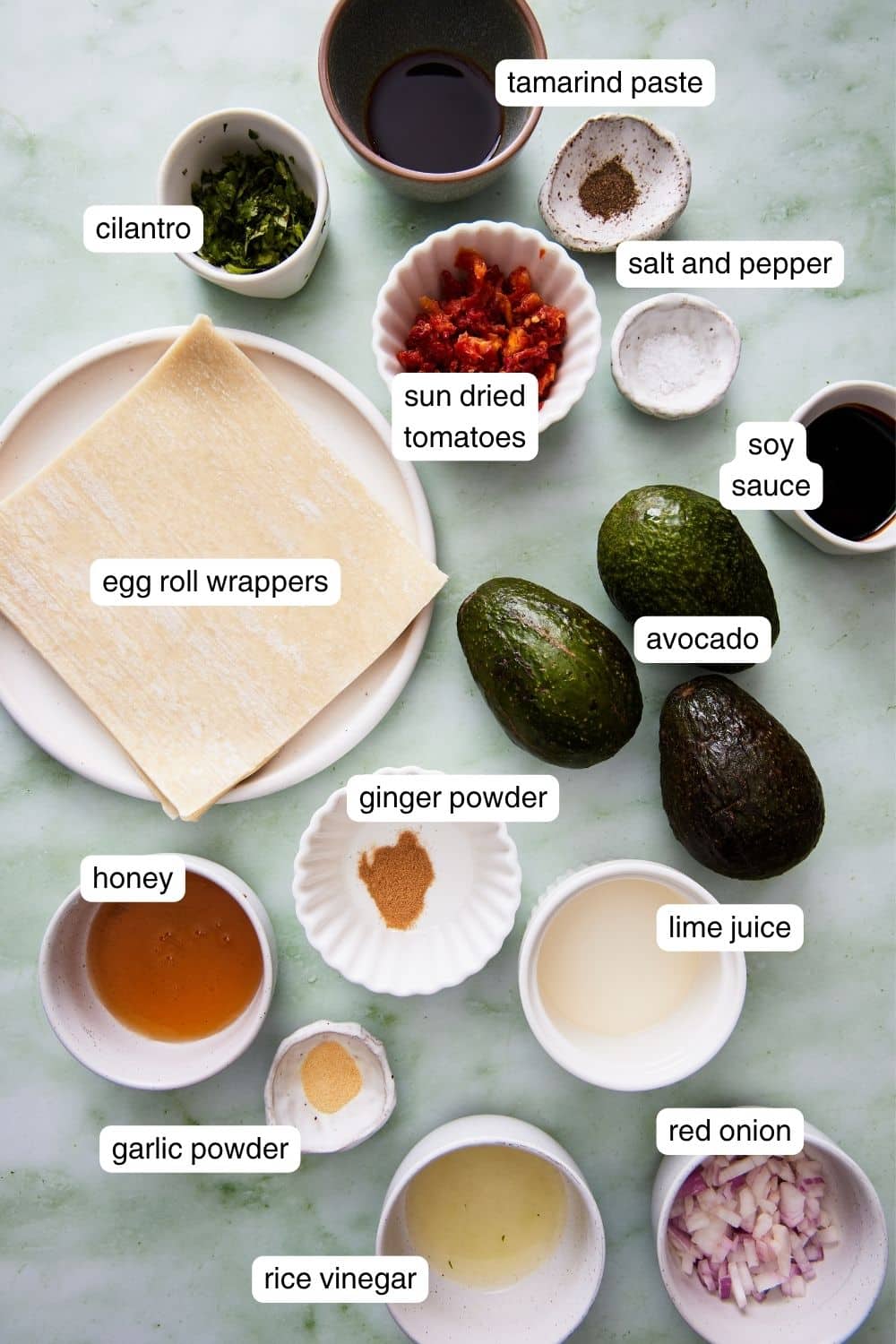 Labeled ingredients for avocado egg rolls.