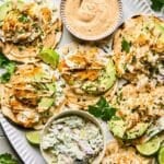 Top down view of a platter full of air fryer fish tacos.