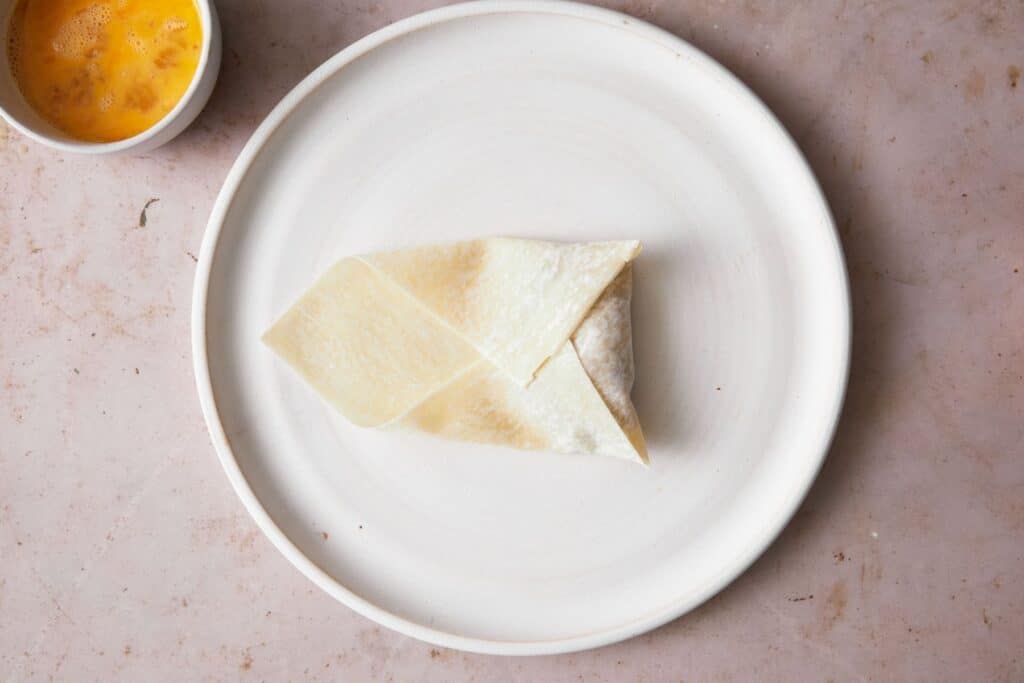 Wrapping up an egg roll.