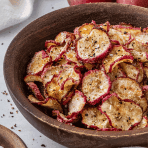 Air fryer radish chips in a wood bowl.