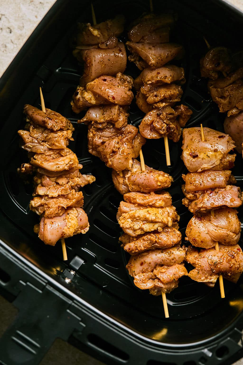 Skewers of marinated chicken in the air fryer.