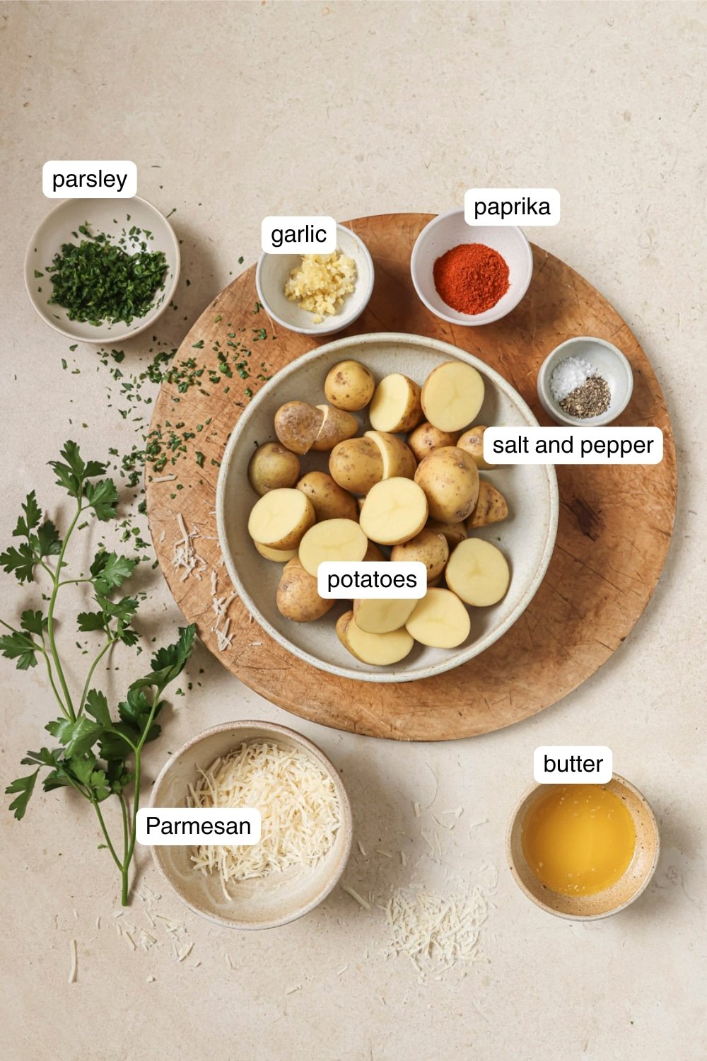 Ingredients for Air Fryer Parmesan Potatoes in ingredient bowls.