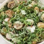 Close up of dressed warm potato salad.