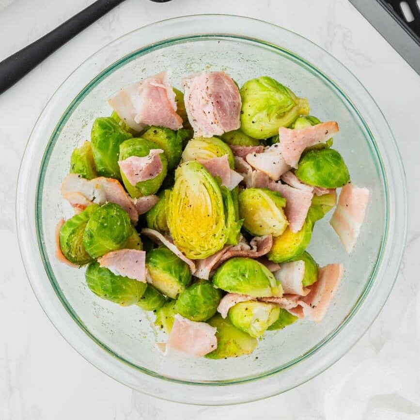 brussels sprouts and bacon in a glass bowl