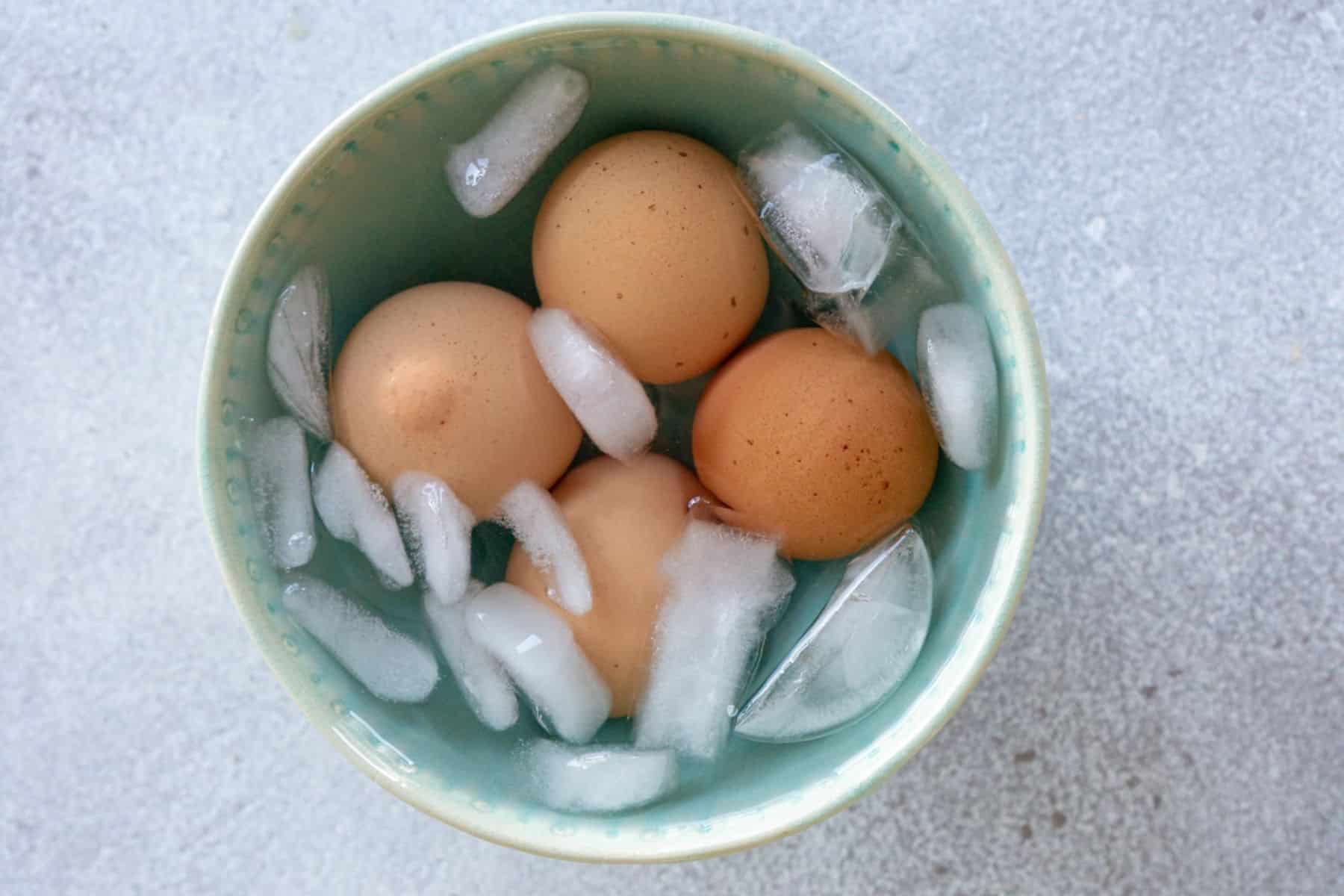 Hard boiled eggs in an ice bath.