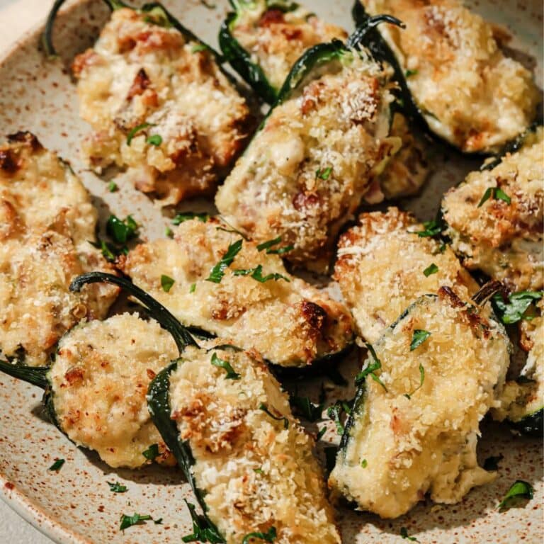 Air fried jalapeno poppers on a plate.