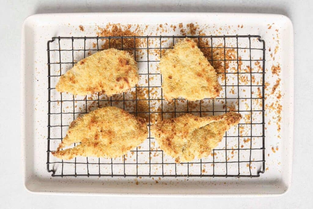 Golden brown baked chicken cutlets.