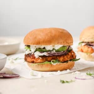 Salmon burger sitting on table