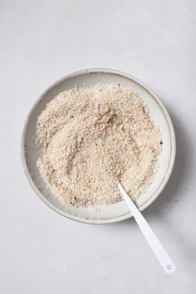 Mixing together the bread crumb coating for air fried shrimp.