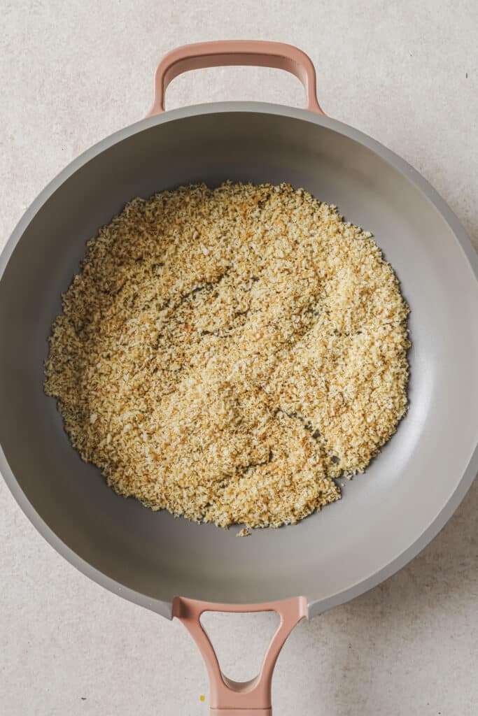 Toasting panko in a large skillet.