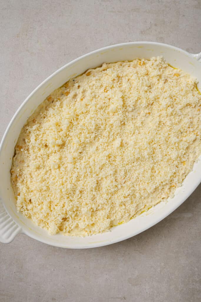 Corn casserole topped with cheese.