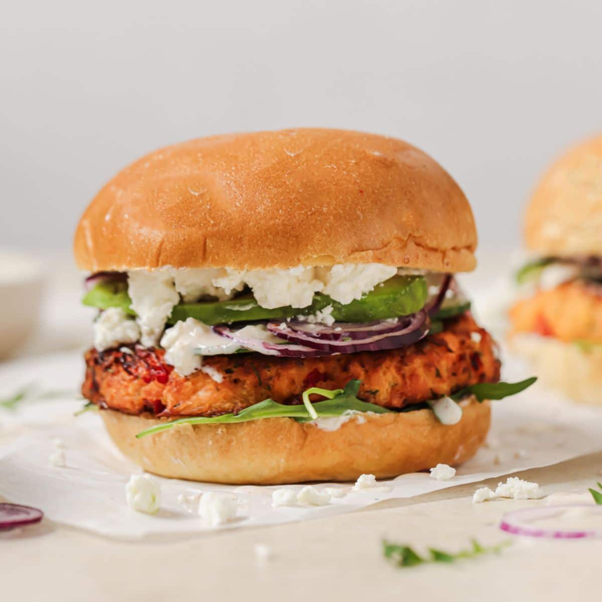 Air fryer salmon burger sitting on table.