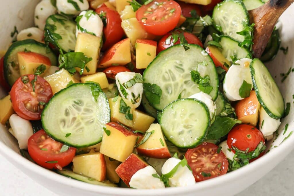 Combining ingredients for cherry tomato salad.