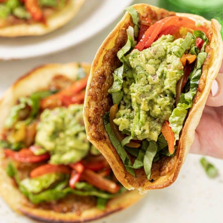 Holding a smashburger taco.