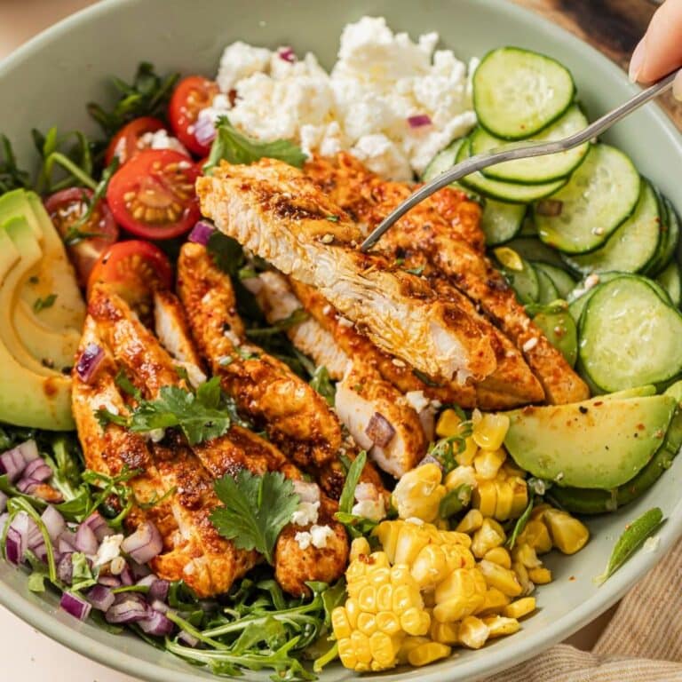 A bowl of tajin grilled chicken salad.