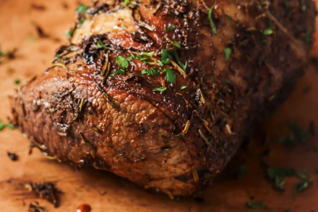Cooked air fryer brisket on a cutting board.