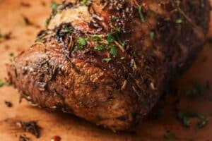 Cooked air fryer brisket on a cutting board.