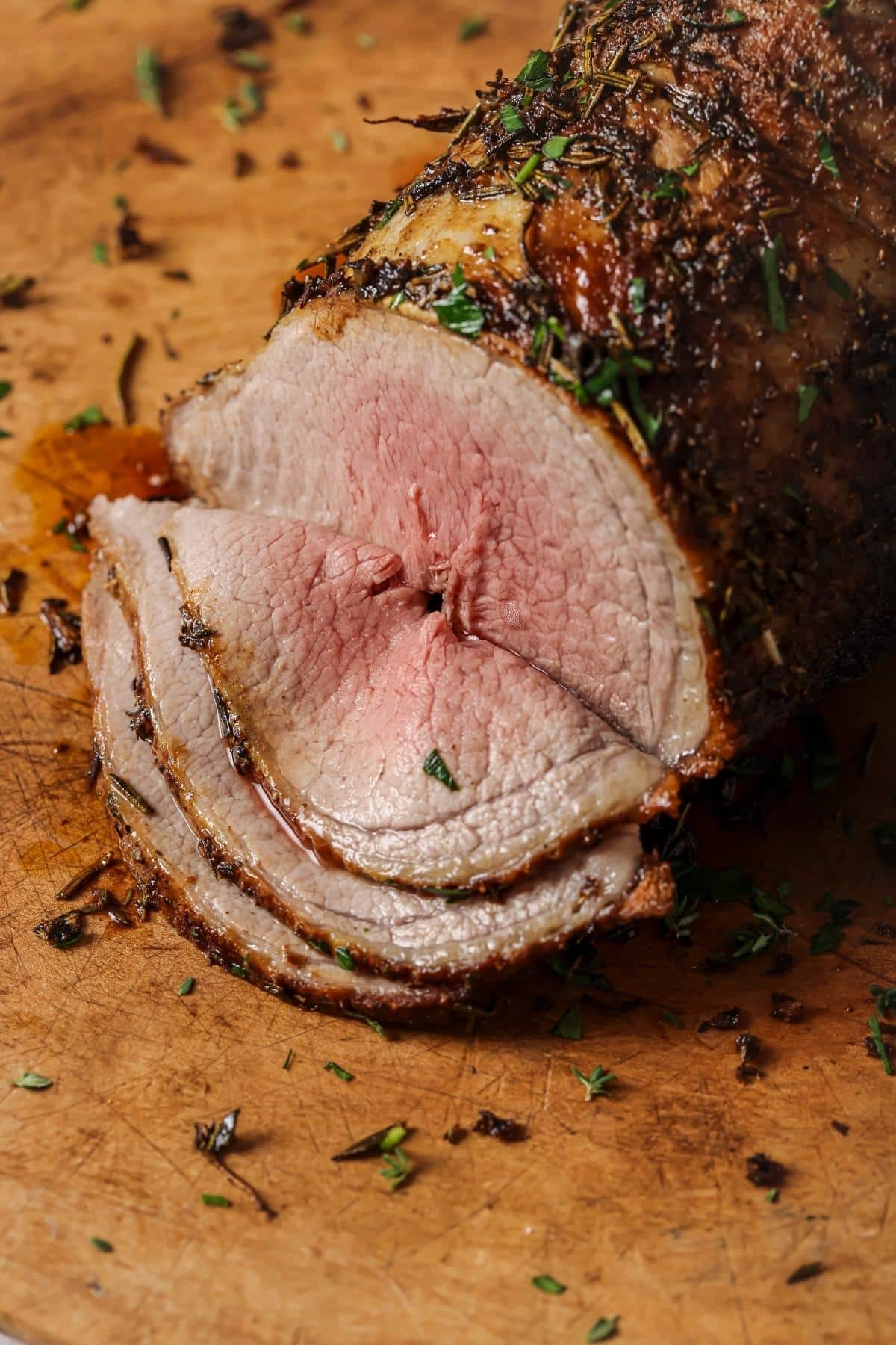 Sliced beef brisket on a cutting board.