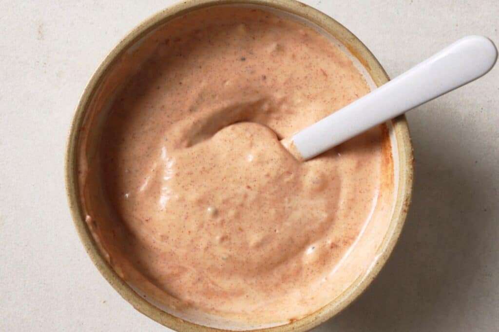 Making burger sauce in a medium bowl.