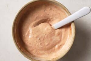 Making burger sauce in a medium bowl.