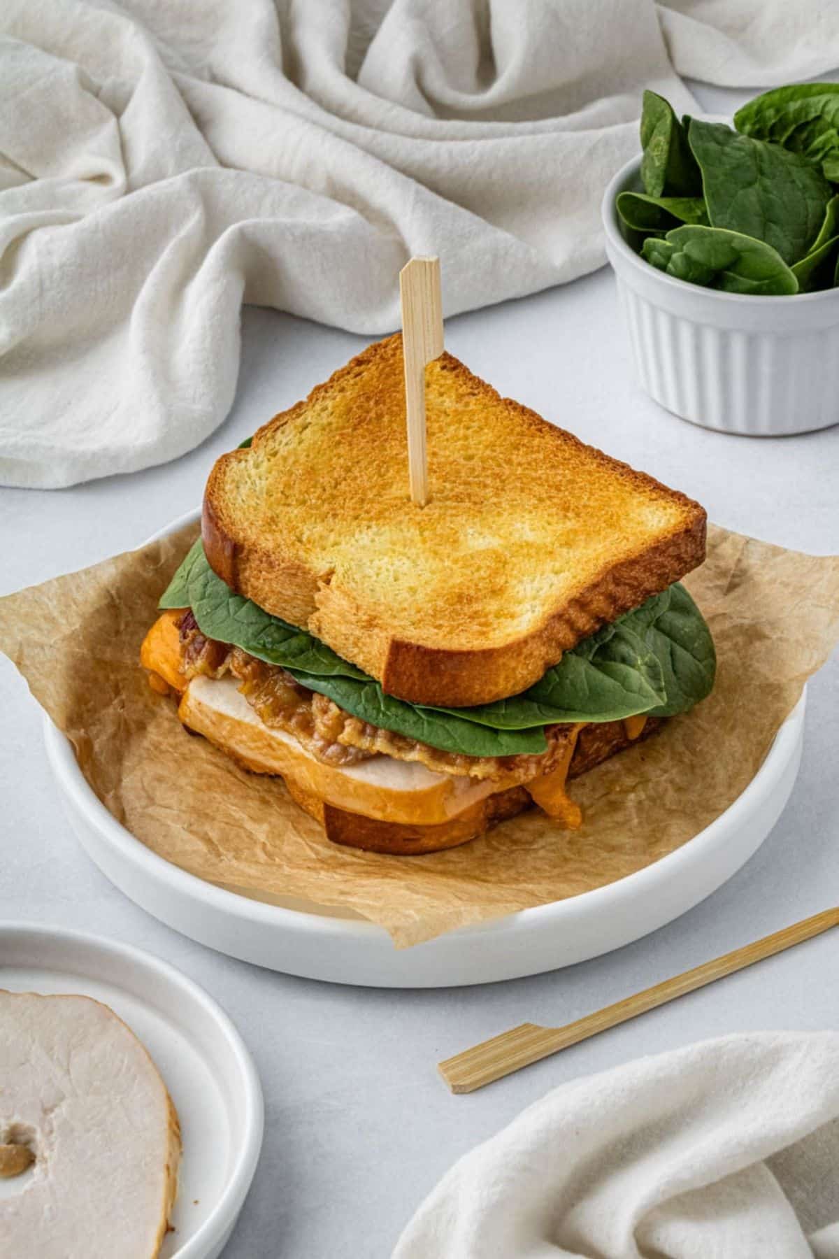 An air fryer turkey sandwich on a plate.