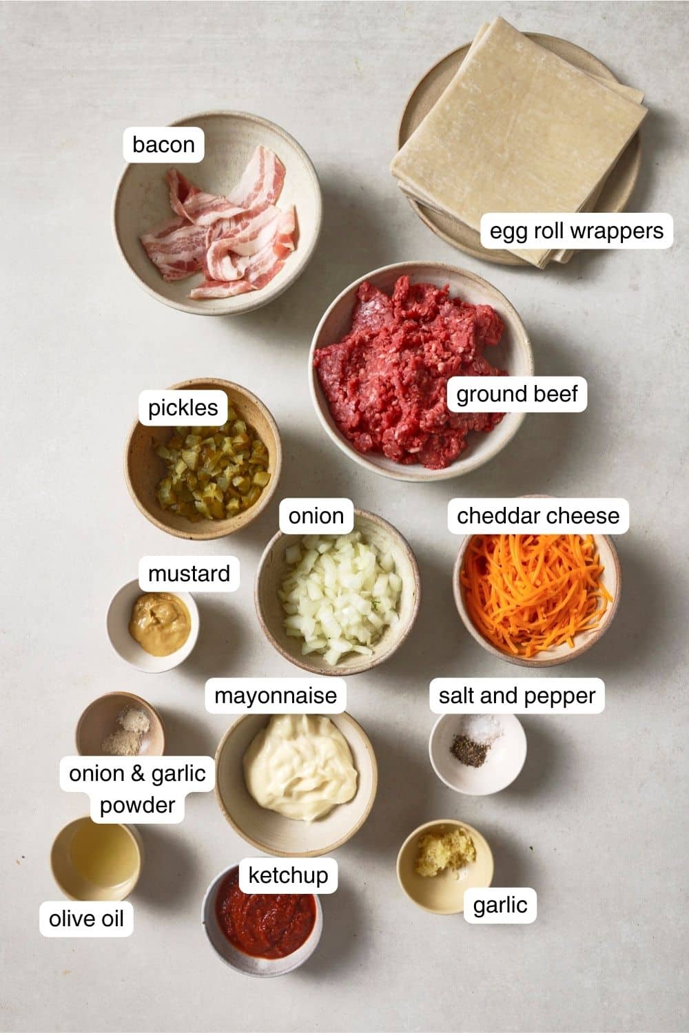 Labeled ingredients for air fryer cheeseburger egg rolls.