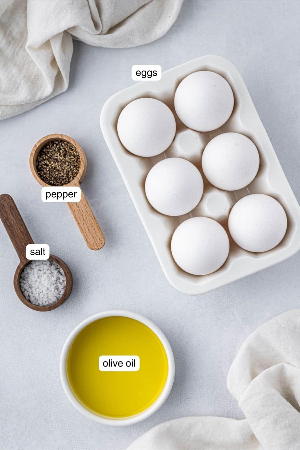 Labeled ingredients for air fryer fried eggs.