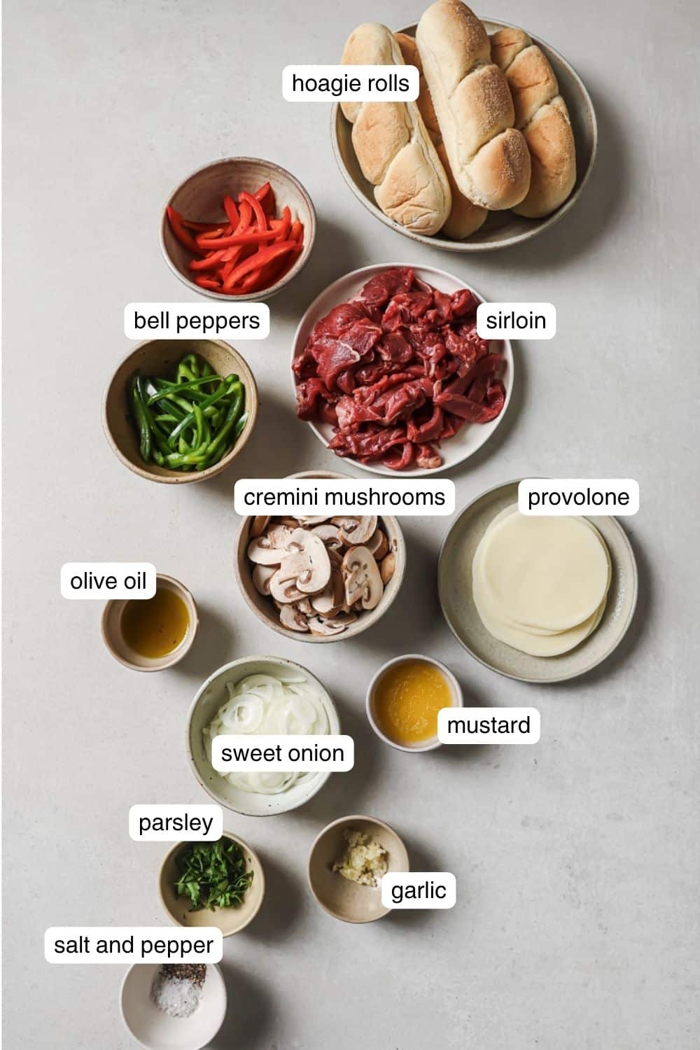 Labeled ingredients for air fryer philly cheesesteak.