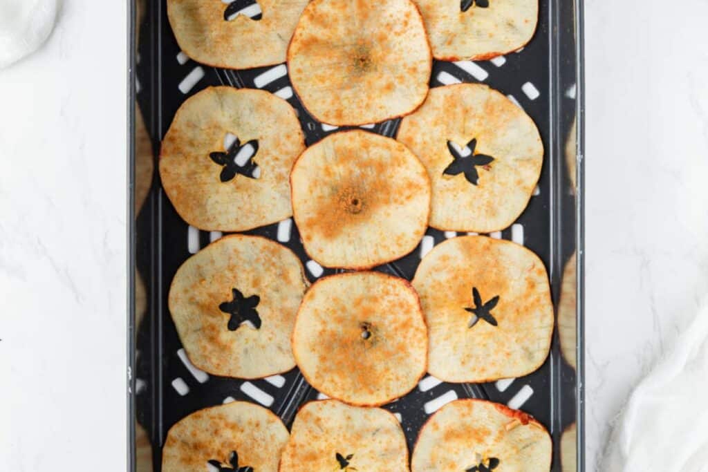 Apple chips in the air fryer basket.