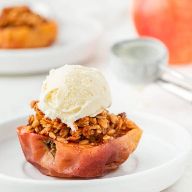Air fryer baked apple with a scoop of vanilla ice cream.